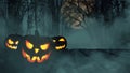 Scary glowing pumpkins on wooden boards in a foggy forest with moon and bats. Happy halloween creative Royalty Free Stock Photo