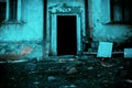 Scary grunge background in horror style, an open door entrance to a dangerous staircase of an old crumbling house, steps Royalty Free Stock Photo