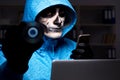 The scary hacker hacking security firewall late in office