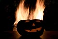 Scary Halloween background with fire flames. Jack o lantern head Royalty Free Stock Photo