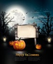 Scary Halloween background with a wooden sign. Royalty Free Stock Photo