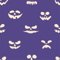 Scary Halloween faces seamless pattern