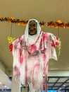 Scary Halloween holiday decoration with bloody ghost hang on ceiling Royalty Free Stock Photo