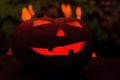 Scary halloween pumpkin in the evening with fire flames. Jack o lantern head Royalty Free Stock Photo