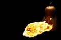 Scary Halloween pumpkin is spewing fire flame isolated on black Royalty Free Stock Photo