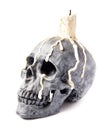 Scary halloween skull with melted candle