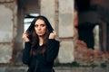 Mysterious Evil Vampire in Front of a Horror Abandoned House