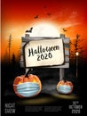 Scary Holiday Halloween background with pumpkins wearing medical face mask and silhouettes of bats, dead trees and wooden sign. Royalty Free Stock Photo