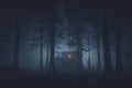 Scary house in mysterious horror forest at night Royalty Free Stock Photo