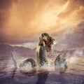 Scary Loch Ness Monster emerging from water Royalty Free Stock Photo