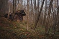 A scary looking crumbling abandoned cottage.