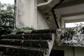 Scary looking stone stair from a abandoned two floor building leading to the second floor of the building with horror looks