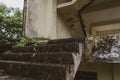 Scary looking stone stair from a abandoned two floor building leading to the second floor of the building with vintage looks