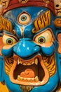 Scary Nepali mask in the market. Colorful mask used for dancing at a yearly festival called Tsechu to celebrate Buddhism Royalty Free Stock Photo