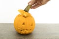 Scary orange halloween pumpkin on a wood table