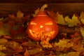 The scary orange pumpkin with light inside