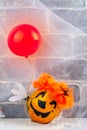 Scary red hair clown made from pumpkin, holding red balloon Royalty Free Stock Photo