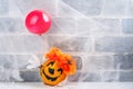 Scary red hair clown made from pumpkin, holding red balloon Royalty Free Stock Photo