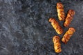 Scary sausage mummies in dough for kids party. Funny crazy Halloween food for children Royalty Free Stock Photo