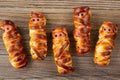 Scary sausage mummies in dough for kids party. Funny crazy Halloween food for children Royalty Free Stock Photo