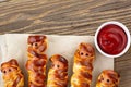 Scary sausage mummies in dough for kids party. Funny crazy Halloween food for children Royalty Free Stock Photo