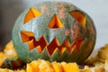 Scary smiling pumpkin halloween lantern on table Royalty Free Stock Photo