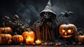 A scary smiling skeleton in a black raincoat and magic hat with orange Halloween pumpkins on a dark background