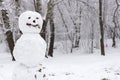 Scary snowman in the winter forest