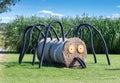 Scary spider made of round hay bales and plastic pipe