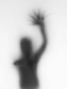 a scary thriller blurry shape figure black and white shadow haunted on halloween