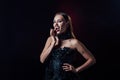 Vampire girl with fangs in black gothic dress isolated on black Royalty Free Stock Photo