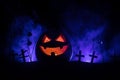 Scary view of zombies at cemetery dead tree, moon, church and spooky cloudy sky with fog, Horror Halloween concept with glowing pu