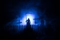 Scary view of zombies at cemetery dead tree, moon, church and spooky cloudy sky with fog, Horror Halloween concept with glowing Royalty Free Stock Photo