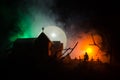 Scary view of zombies at cemetery dead tree, moon, church and spooky cloudy sky with fog, Horror Halloween concept Royalty Free Stock Photo