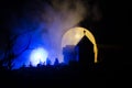Scary view of zombies at cemetery dead tree, moon, church and spooky cloudy sky with fog, Horror Halloween concept Royalty Free Stock Photo