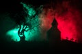 Scary view of zombies at cemetery dead tree, moon, church and spooky cloudy sky with fog, Horror Halloween concept. Royalty Free Stock Photo
