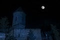 Scary view of zombies at cemetery dead tree, moon, church and spooky cloudy sky with fog, Horror Halloween concept. Toned Royalty Free Stock Photo