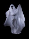 Scary white ghost at big eye on black background for Halloween concept