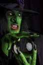 Scary witch with her crystal ball. Royalty Free Stock Photo