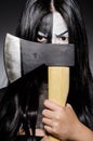 Scary woman with metal axe Royalty Free Stock Photo