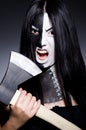 Scary woman with metal axe Royalty Free Stock Photo