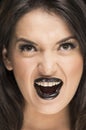Scary young woman wearing goth makeup