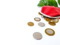 Scattered Belarusian coins from a red leather purse on a white background. Royalty Free Stock Photo