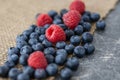 Scattered blueberries and raspberries