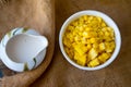 Scattered boiled of yellow ripe corn eating with milk