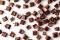 Scattered chocolate squares on a white background,. Generative Ai