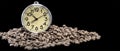 Scattered coffee beans, classic alarm clock. Morning coffee day start. Concept for advertising. Time to drink coffee Royalty Free Stock Photo