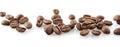 Scattered coffee beans in line on white Royalty Free Stock Photo