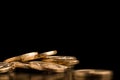 Scattered coins on a black background Royalty Free Stock Photo
