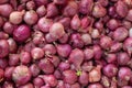 Scattered collection of red onions